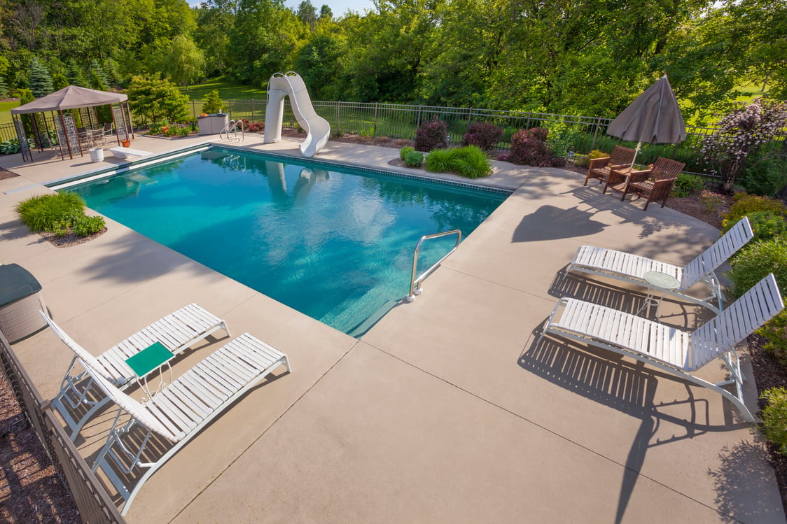 Swimming Pool Area With Pool-Side Chairs